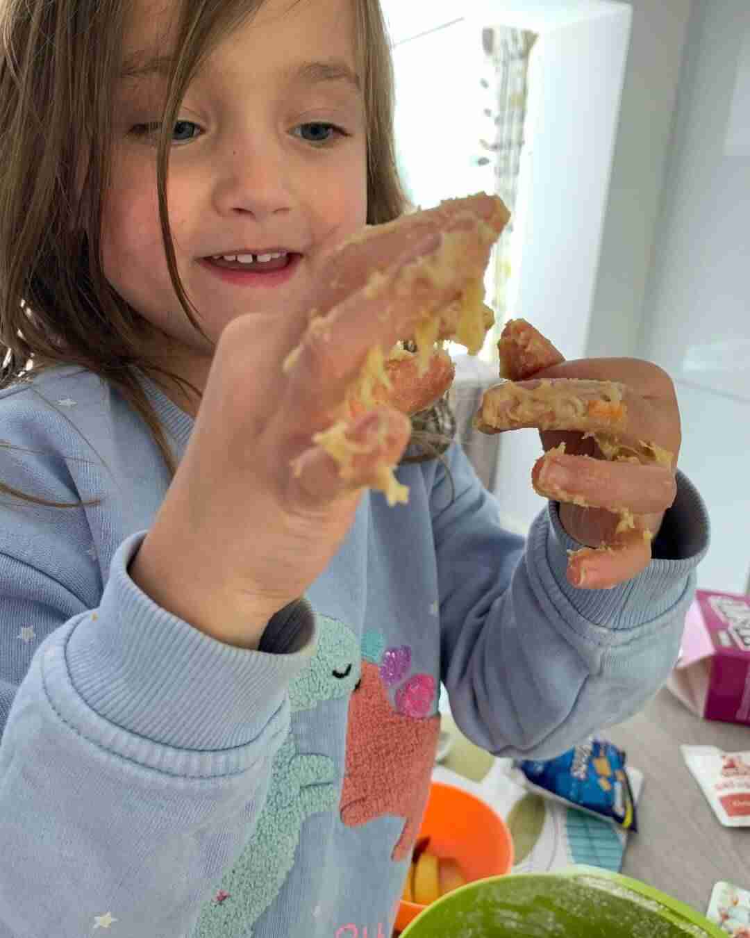 A child demonstrating messy play 